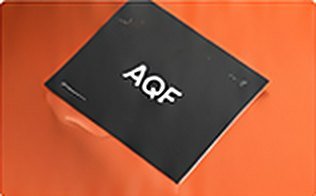 AQF stationery on an orange background